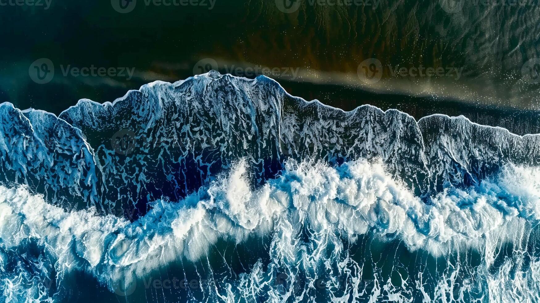Aerial view of powerful ocean waves crashing against the shore photo