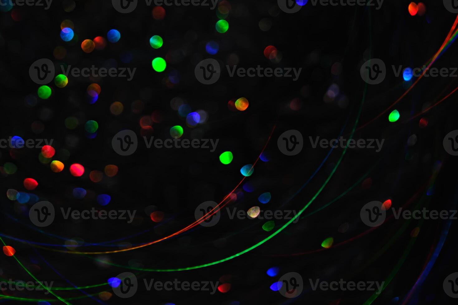 Abstract black background with bokeh of different colors. photo