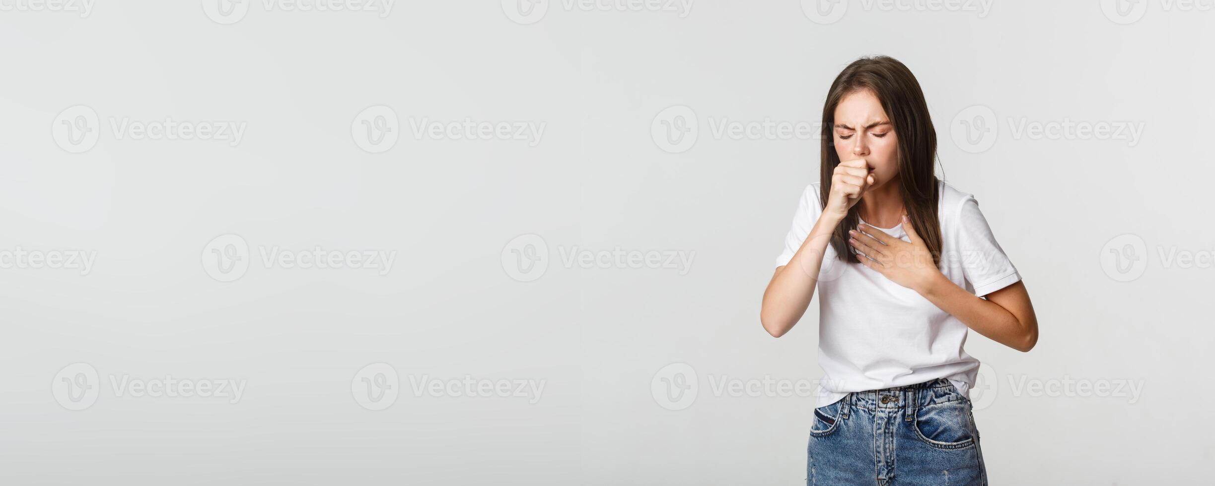 Young woman feeling sick, coughing, have covid-19 symptoms photo