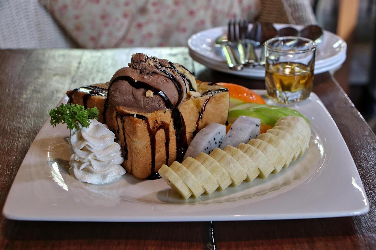 Toast and chocolate ice cream with sliced bananas photo
