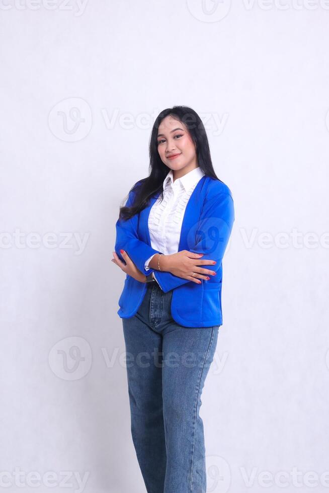 Beautiful young asian office woman wearing blue formal suit standing smiling hands joined. for corporate, beauty, business content photo