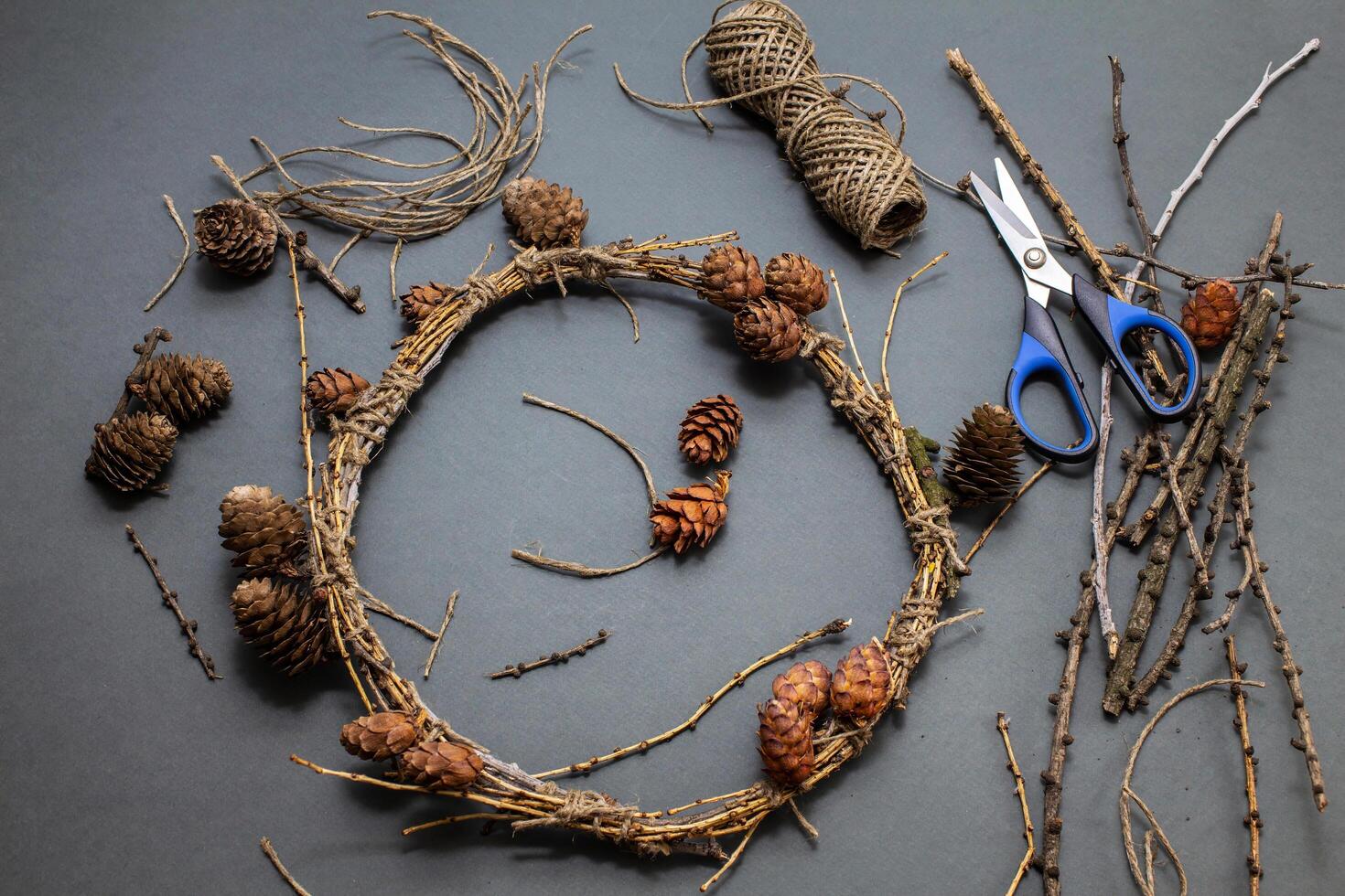 The process of making a Christmas wreath from natural bushes photo