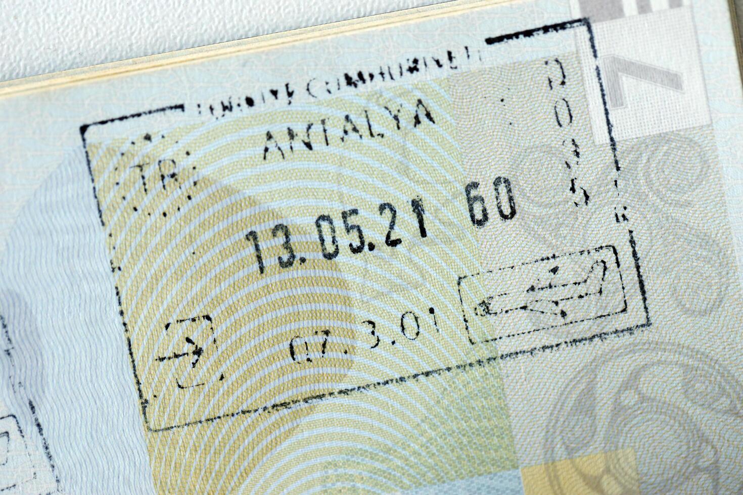 KYIV, UKRAINE - APRIL 20, 2024 Page of foreign passport with visas, Turkiye border stamps, permits to enter countries, concept of traveling around the world, travelers document photo