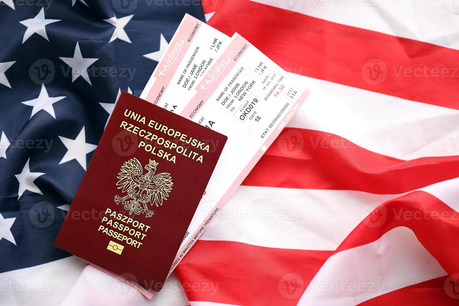 Poland passport with airline tickets on American US flag close up. Tourism and travel photo