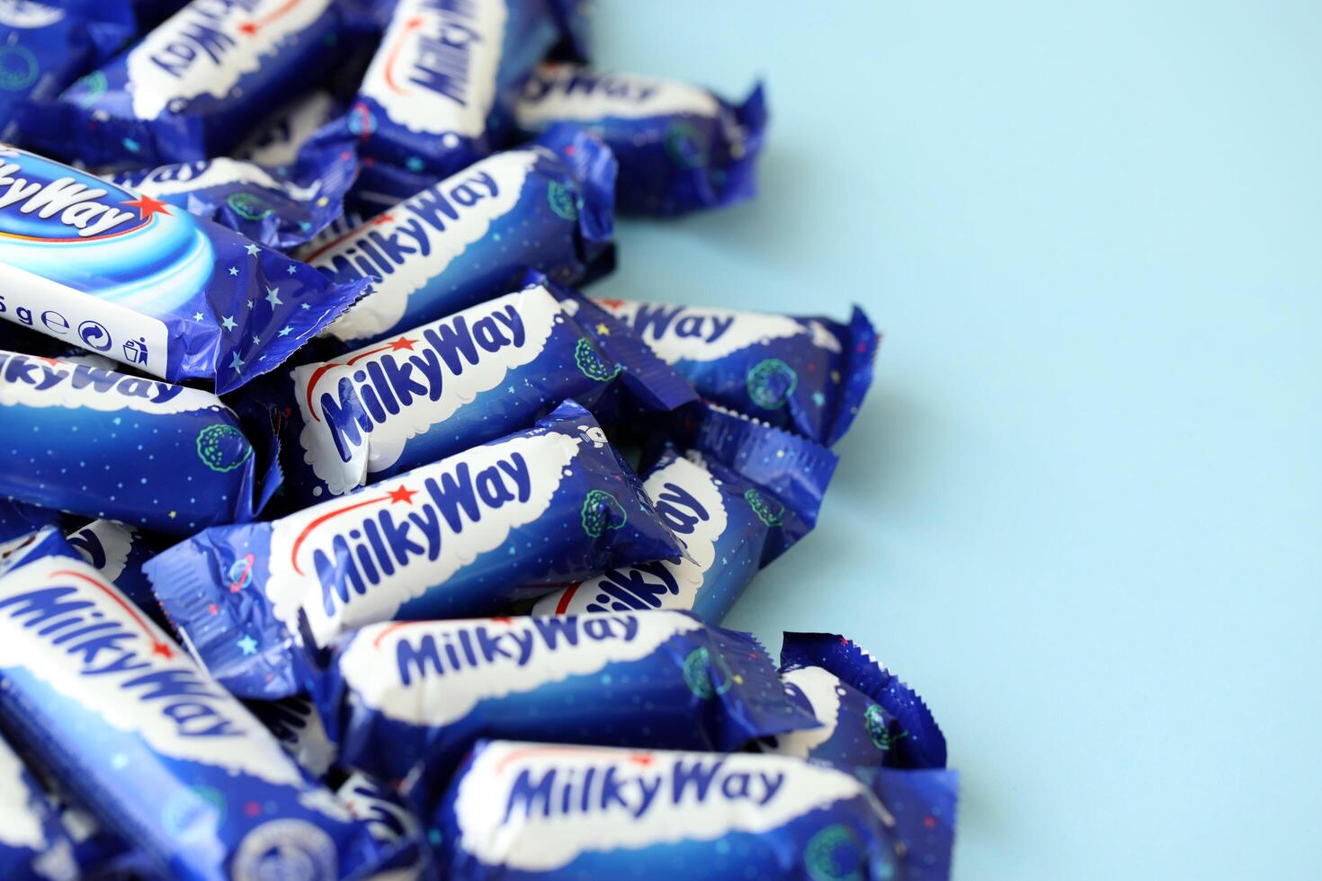 KYIV, UKRAINE - APRIL 20, 2024 Milky Way or MilkyWay small chocolate bars. Milky Way bars is worldwide famous product photo