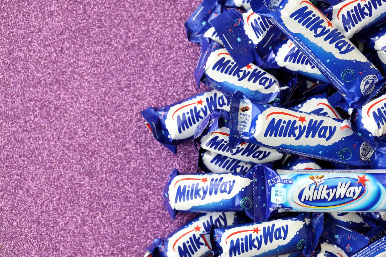 KYIV, UKRAINE - APRIL 20, 2024 Milky Way or MilkyWay small chocolate bars. Milky Way bars is worldwide famous product photo