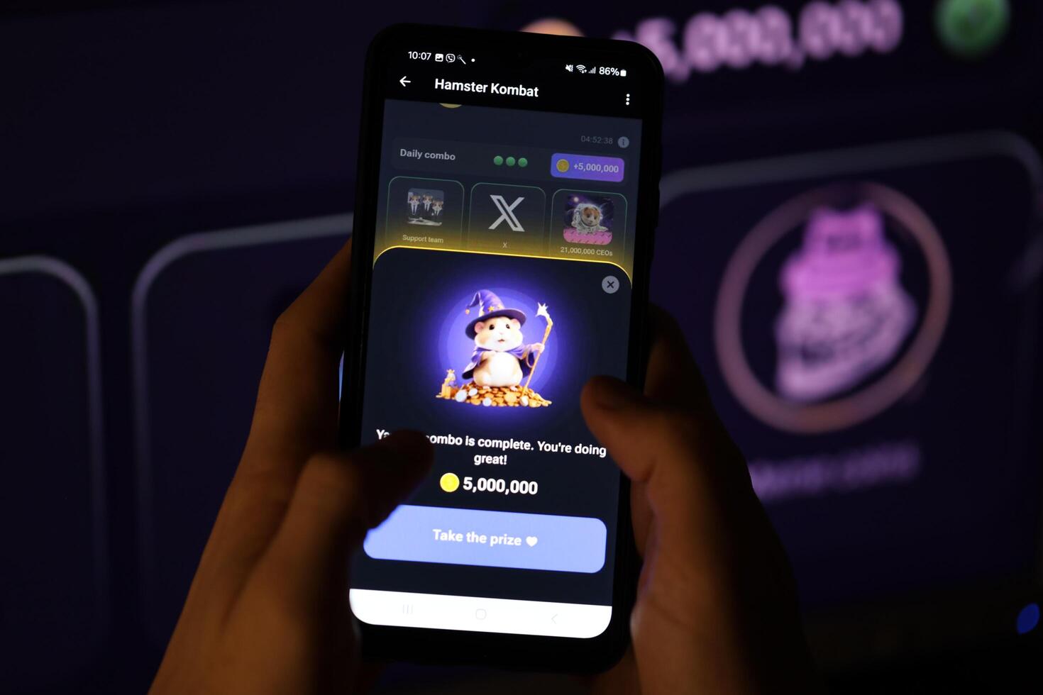 KYIV, UKRAINE - APRIL 20, 2024 Hamster Kombat telegram bot on smartphone screen. Hamster Kombat is a viral Telegram-based crypto game for earn HMSTR tokens by managing virtual crypto exchange photo