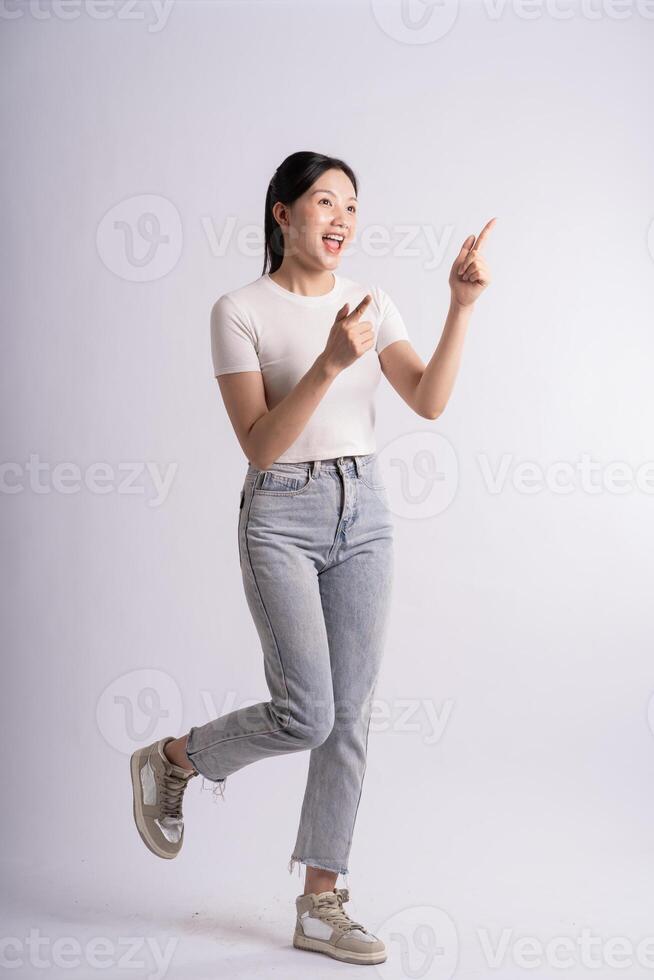 Portrait of beautiful Asian woman posing on white background photo