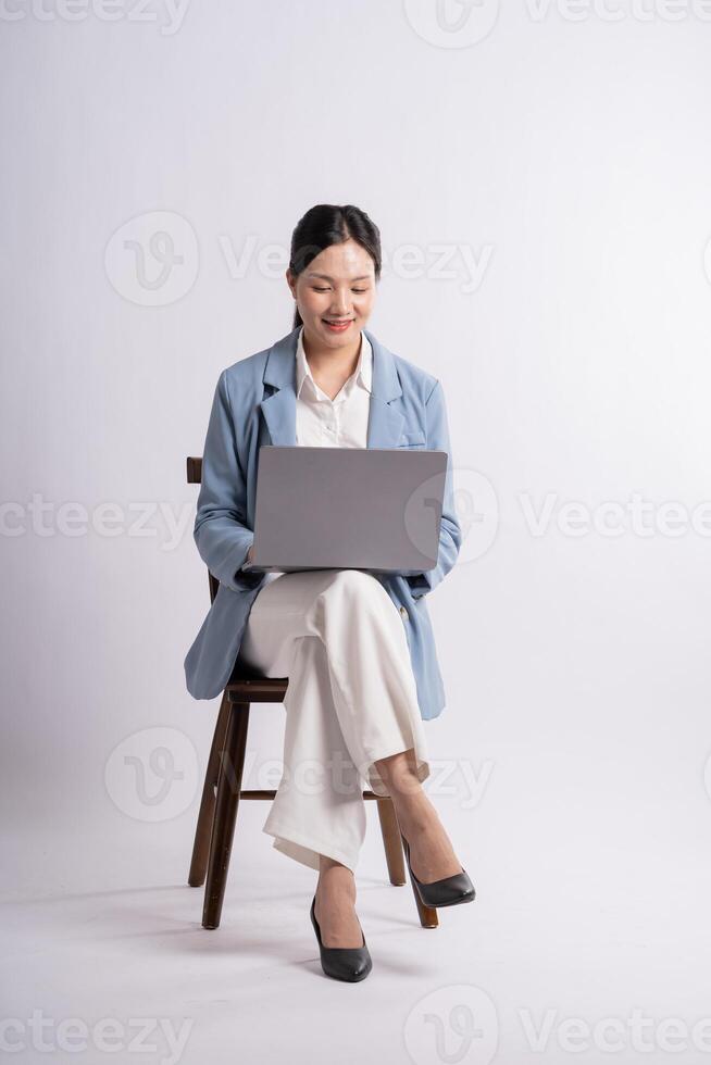 Portrait of young businesswoman posing on white background photo