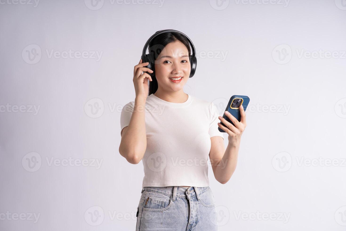 Portrait of beautiful Asian woman posing on white background photo