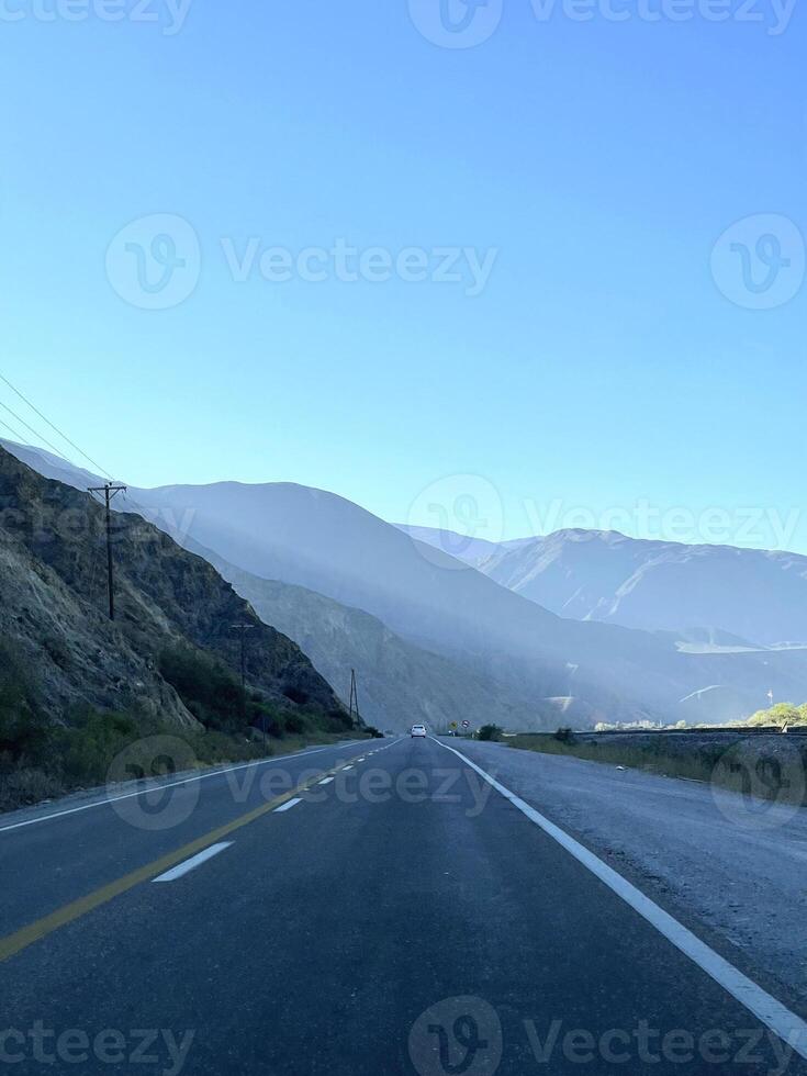 Empty road on the way to the Andes from Salta, Argentina photo