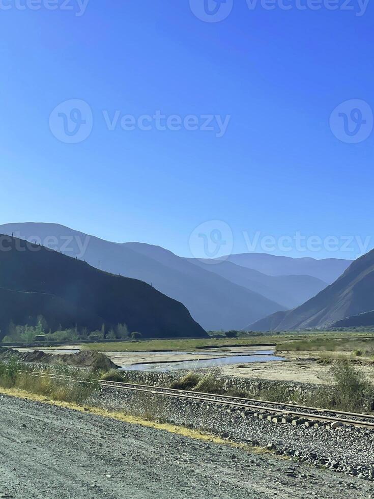 Empty road on the way to the Andes from Salta, Argentina photo
