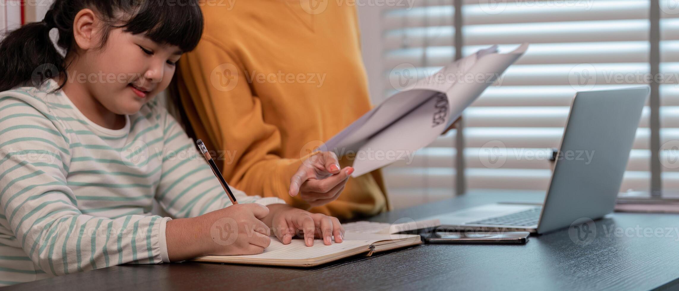 Mother and Child Working from Home Together in a Modern Home Office Setting photo