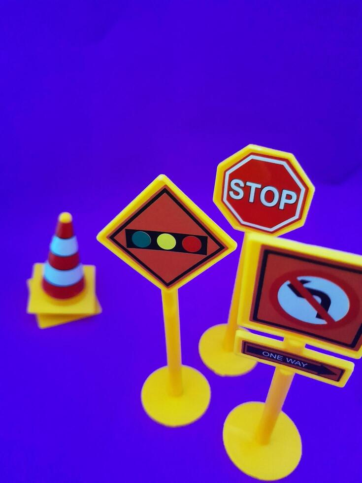 Toy traffic sign on a blue background photo