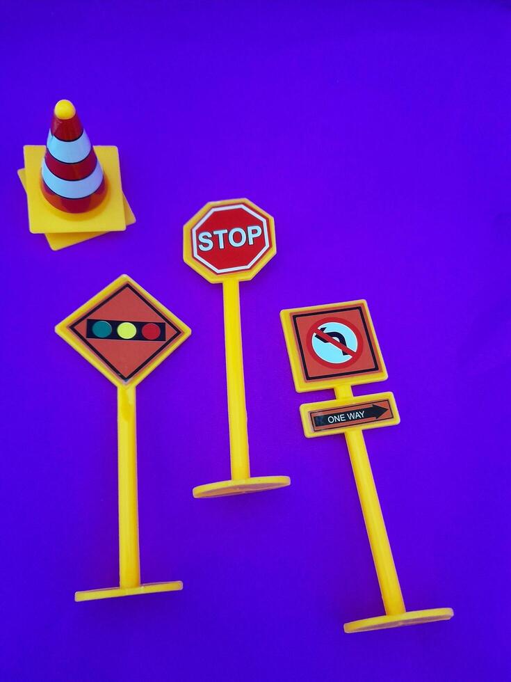 Toy traffic sign on a blue background photo