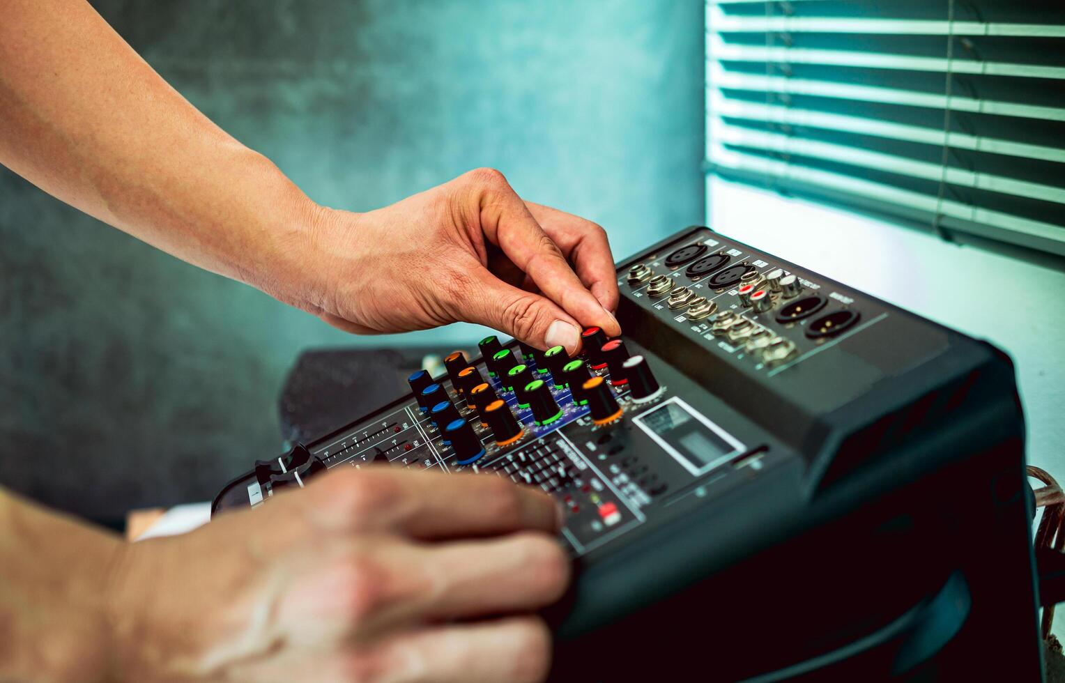 Sound engineer hands adjusting control sound mixer in recording, broadcasting studio,Sound mixer. Professional audio mixing console, buttons, faders and sliders. sound check. photo