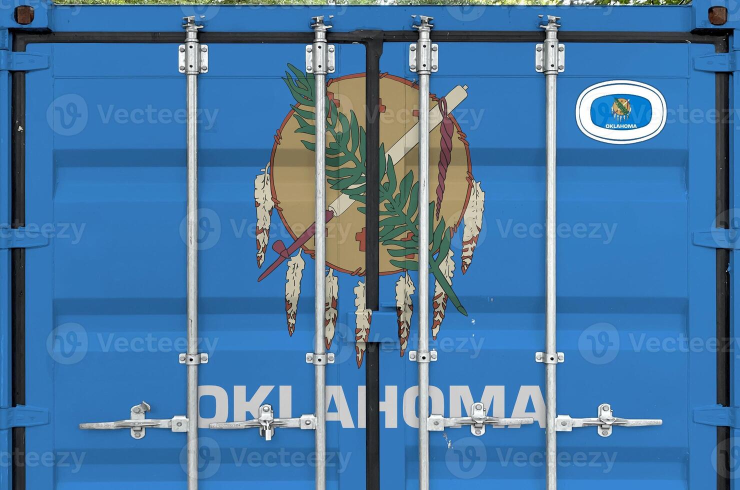 Oklahoma US state flag depicted on metal doors of shipping cargo container outdoors in docks area photo