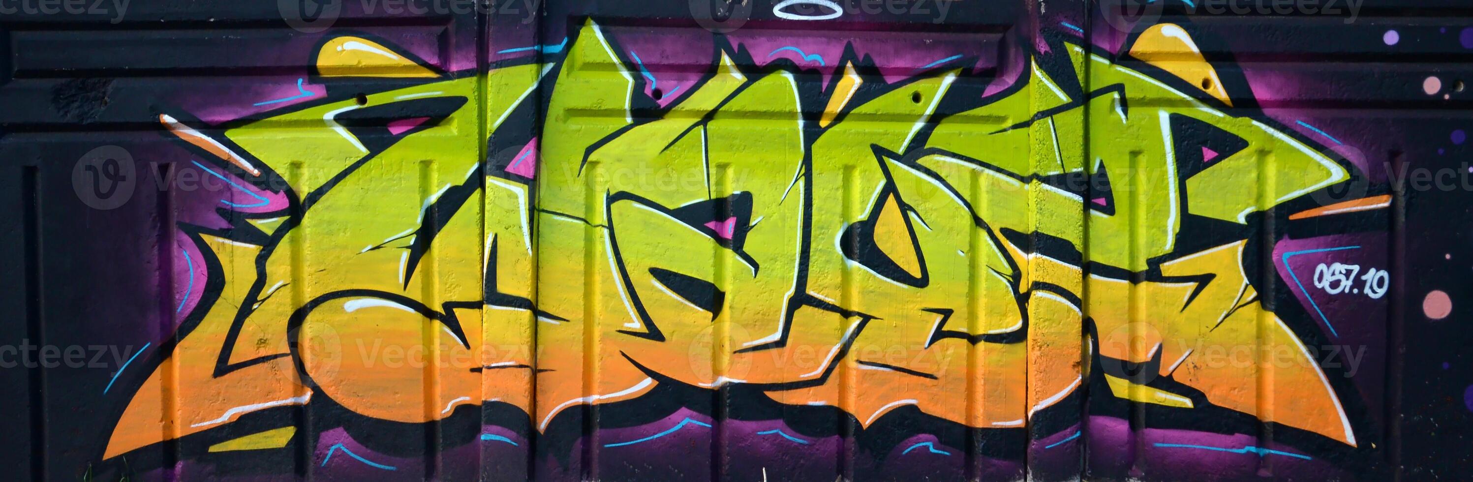 Colorful background of graffiti painting artwork with bright aerosol outlines on wall. Old school street art piece made with aerosol spray paint cans. Contemporary youth culture photo