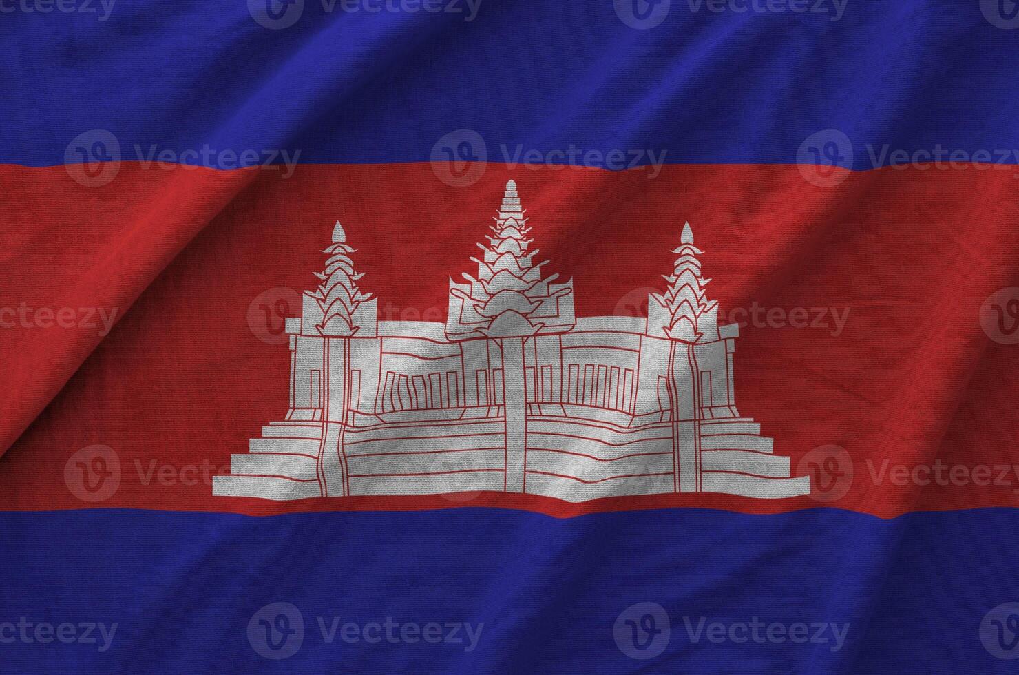 Cambodia flag depicted on folded wavy fabric of old cloth photo