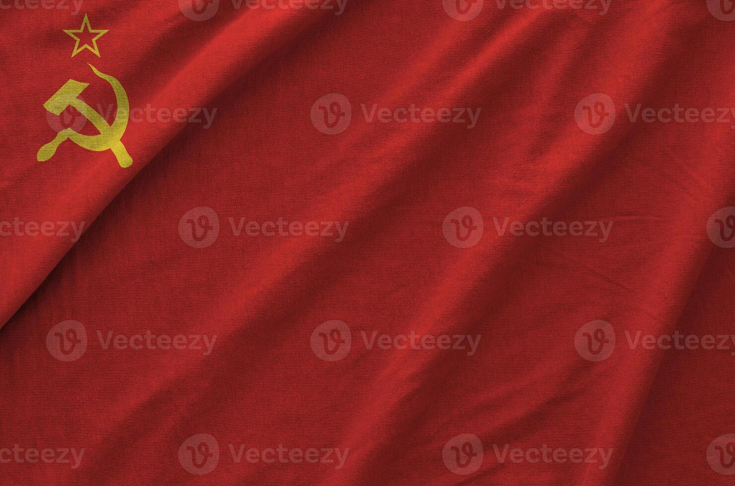 Soviet Union flag depicted on folded wavy fabric of old cloth photo