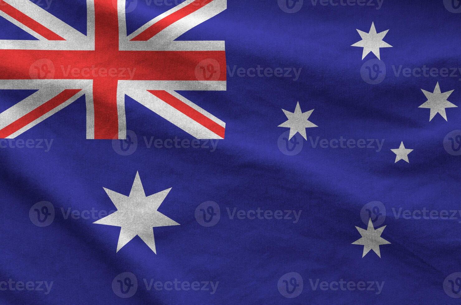 Australia flag depicted on folded wavy fabric of old cloth photo