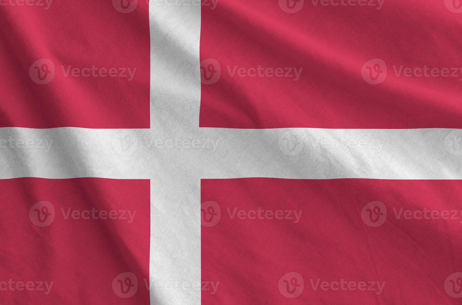 Denmark flag depicted on folded wavy fabric of old cloth photo