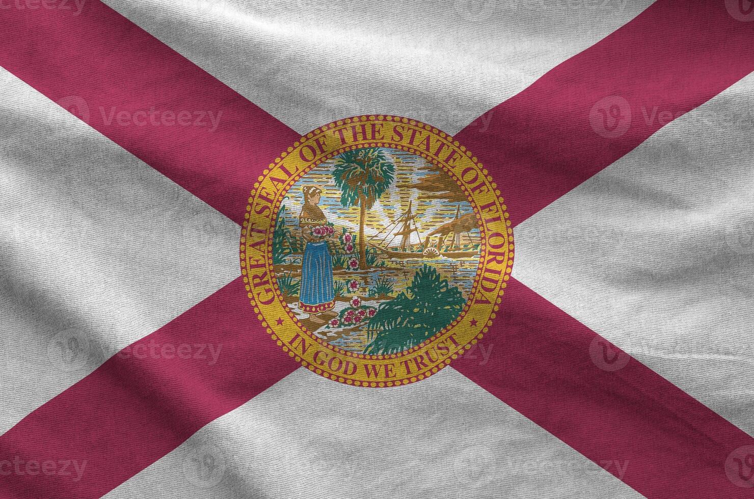 Florida US state flag depicted on folded wavy fabric of old cloth photo