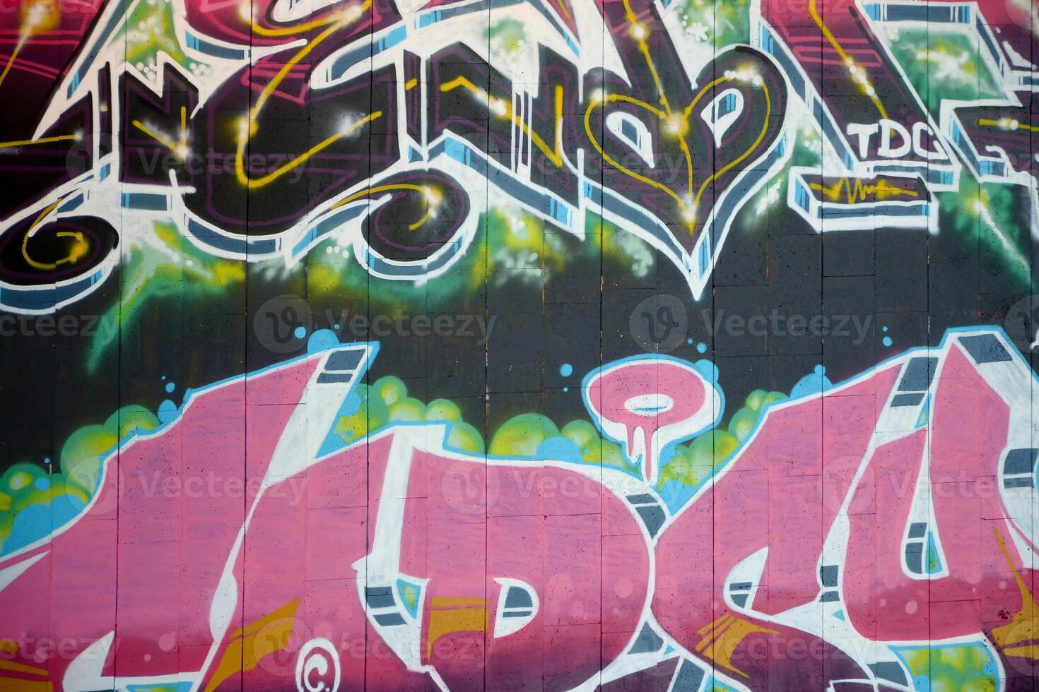 Colorful background of graffiti painting artwork with bright aerosol outlines on wall. Old school street art piece made with aerosol spray paint cans. Contemporary youth culture photo