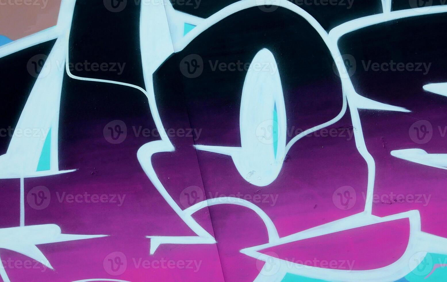 Colorful background of graffiti painting artwork with bright aerosol outlines on wall. Old school street art piece made with aerosol spray paint cans. Contemporary youth culture photo