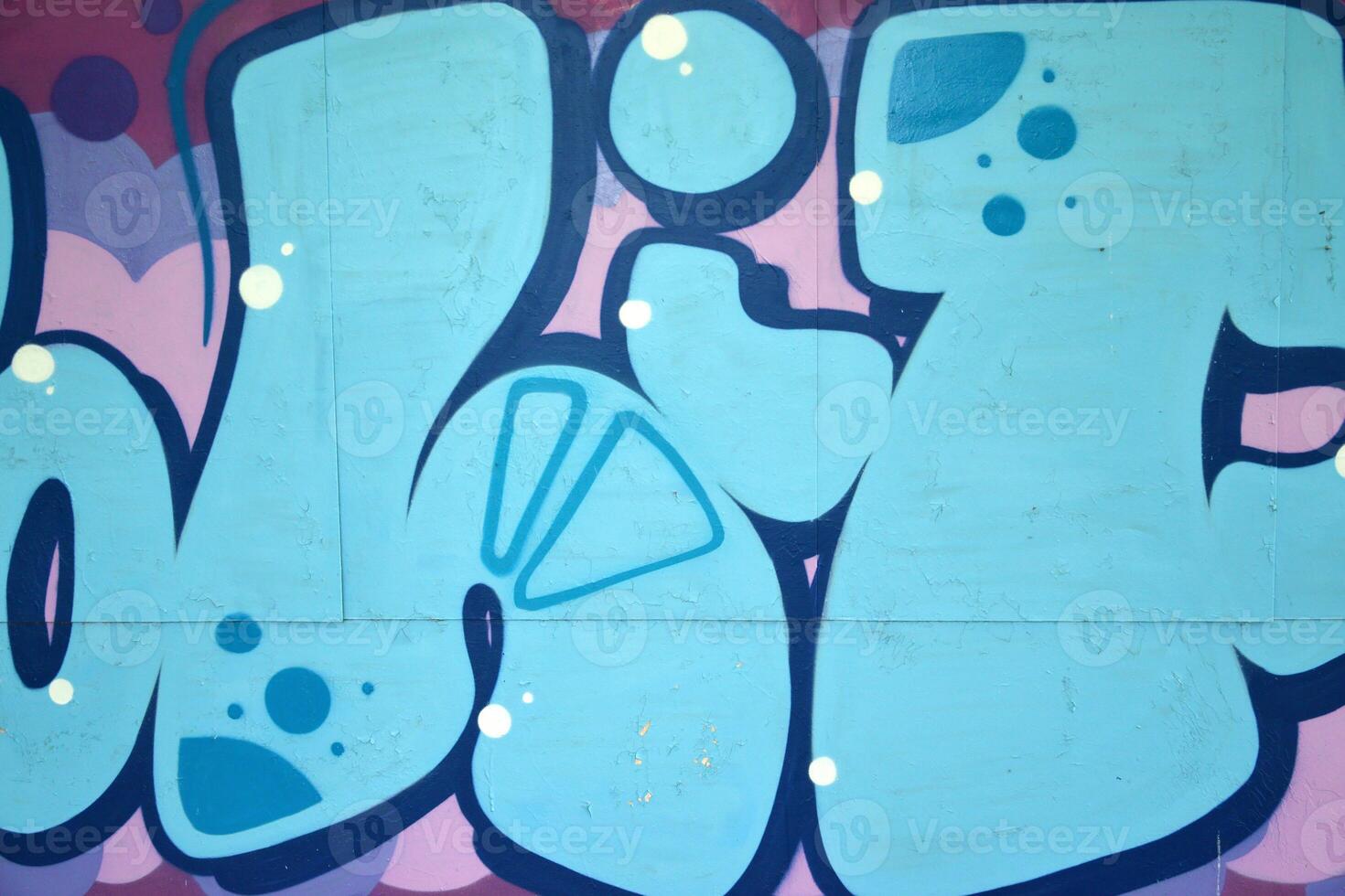 Colorful background of graffiti painting artwork with bright aerosol outlines on wall. Old school street art piece made with aerosol spray paint cans. Contemporary youth culture photo