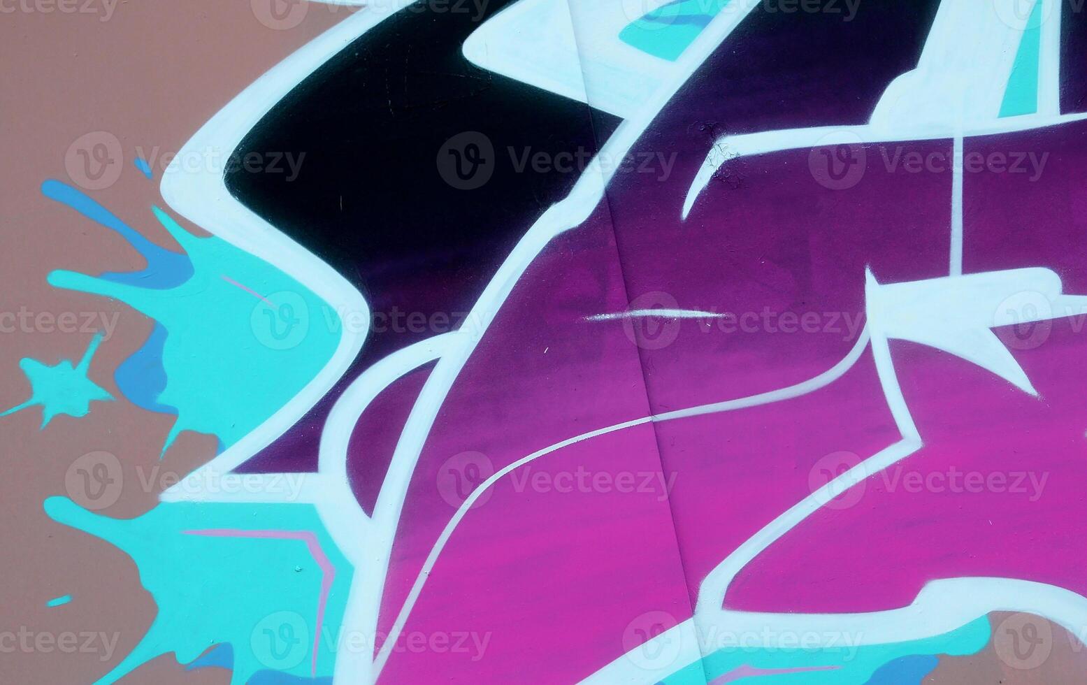 Colorful background of graffiti painting artwork with bright aerosol outlines on wall. Old school street art piece made with aerosol spray paint cans. Contemporary youth culture photo