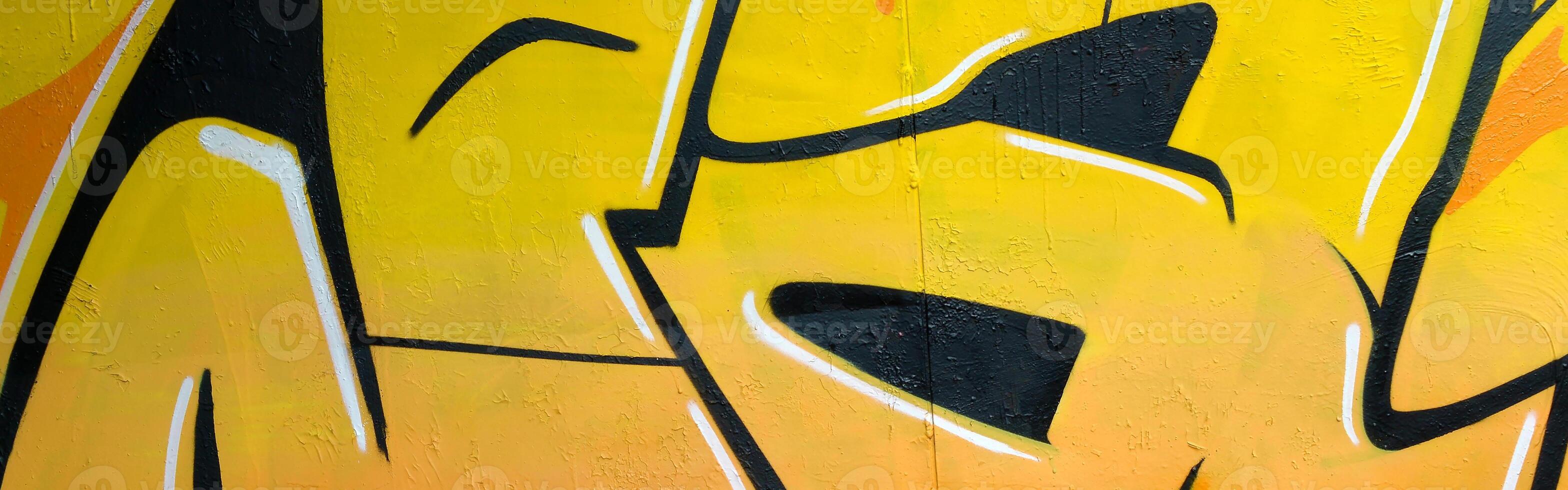 Colorful background of graffiti painting artwork with bright aerosol outlines on wall. Old school street art piece made with aerosol spray paint cans. Contemporary youth culture photo