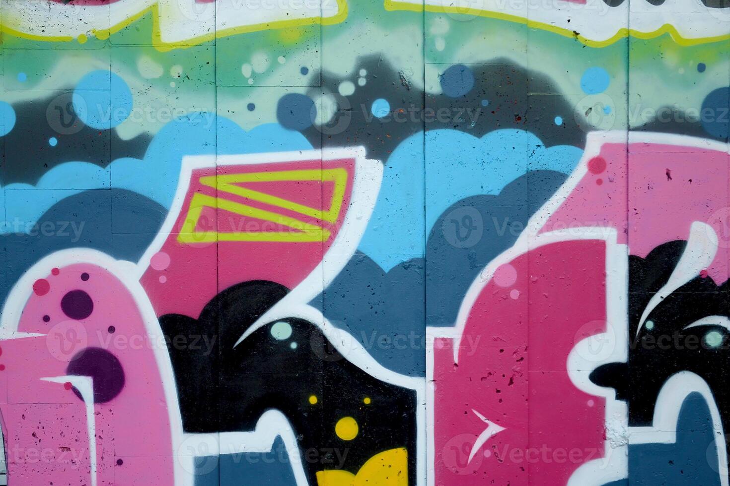 Colorful background of graffiti painting artwork with bright aerosol outlines on wall. Old school street art piece made with aerosol spray paint cans. Contemporary youth culture photo