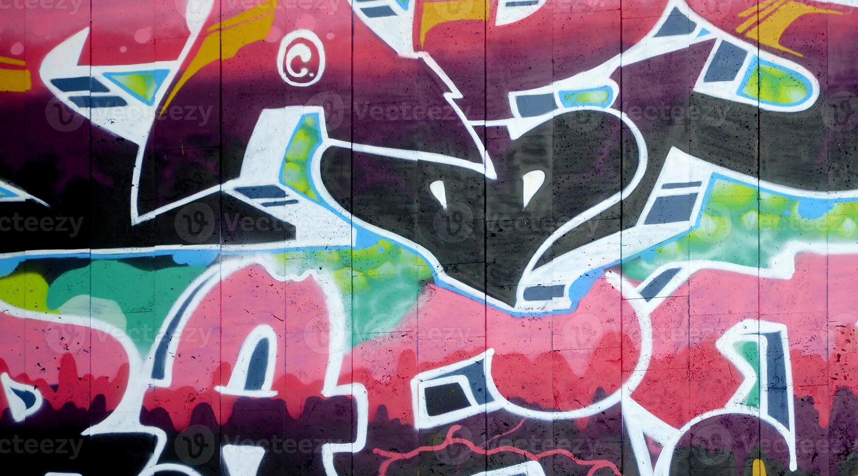 Colorful background of graffiti painting artwork with bright aerosol outlines on wall. Old school street art piece made with aerosol spray paint cans. Contemporary youth culture photo