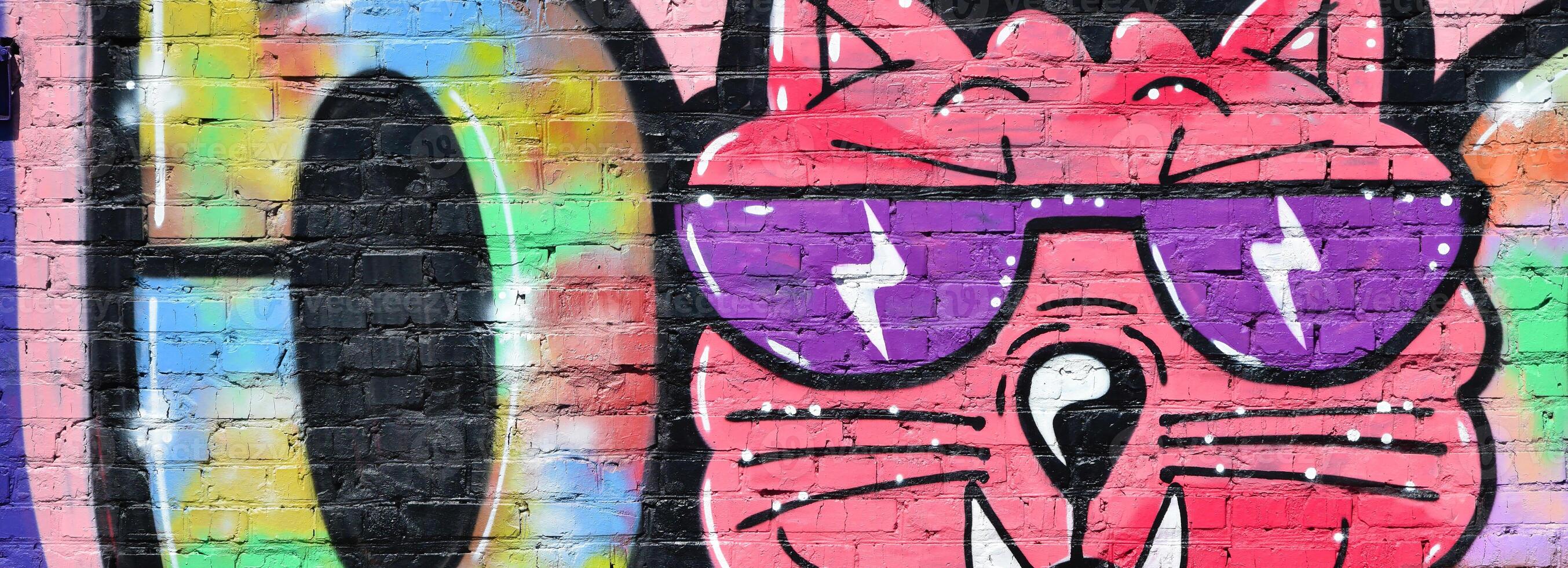 Colorful background of graffiti painting artwork with bright aerosol outlines on wall. Old school street art piece made with aerosol spray paint cans. Contemporary youth culture photo