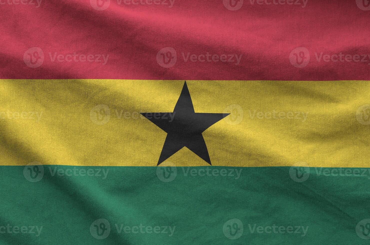 Ghana flag depicted on folded wavy fabric of old cloth photo