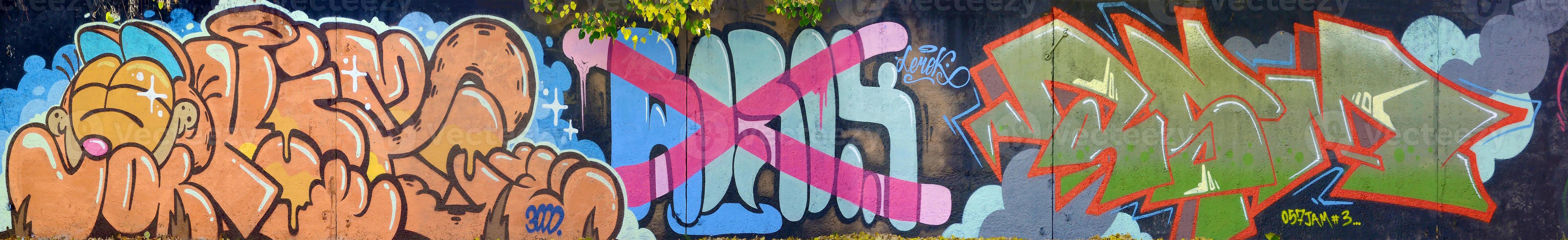 Colorful background of graffiti painting artwork with bright aerosol outlines on wall. Old school street art piece made with aerosol spray paint cans. Contemporary youth culture photo