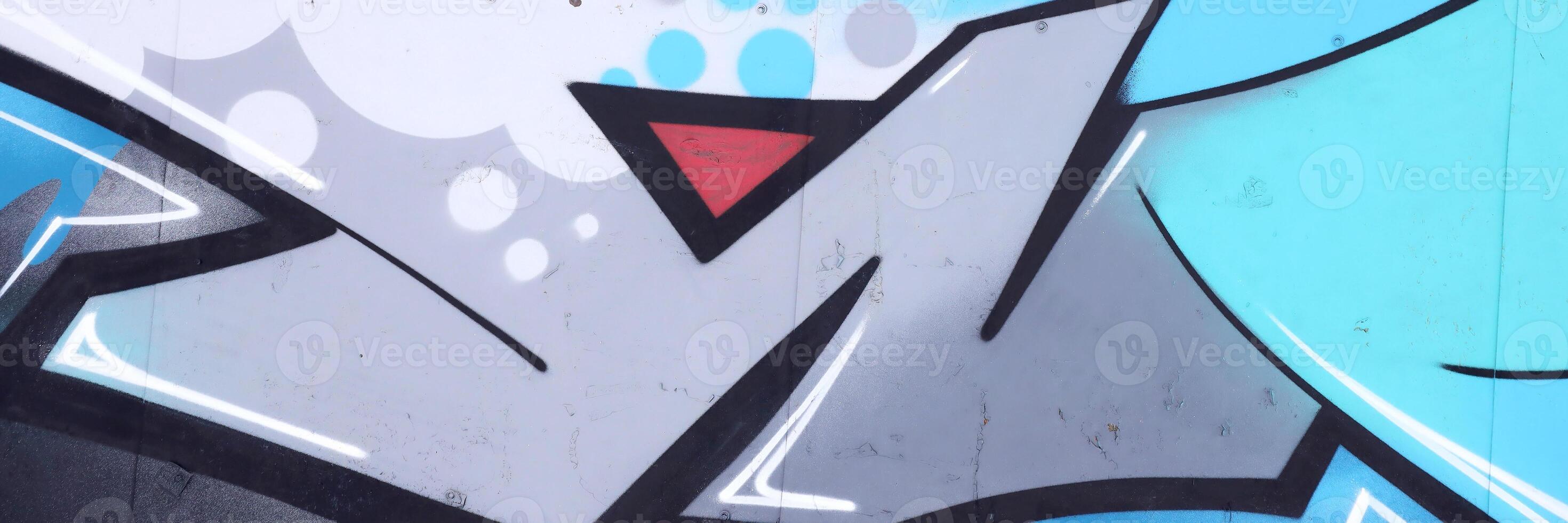 Colorful background of graffiti painting artwork with bright aerosol outlines on wall. Old school street art piece made with aerosol spray paint cans. Contemporary youth culture photo