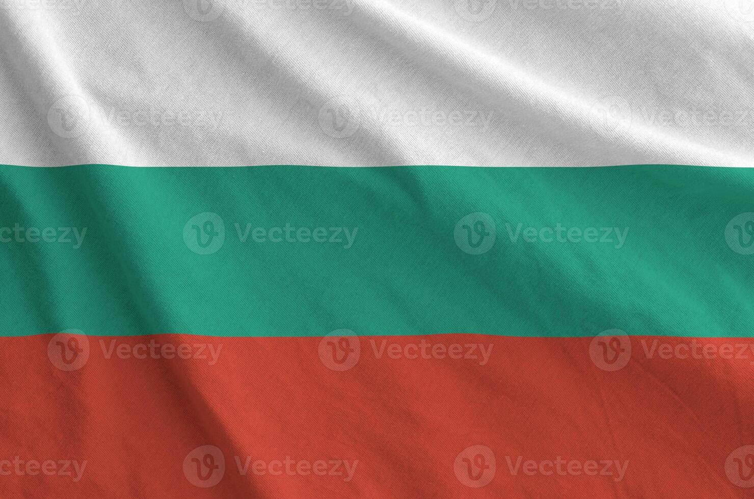 Bulgaria flag depicted on folded wavy fabric of old cloth photo
