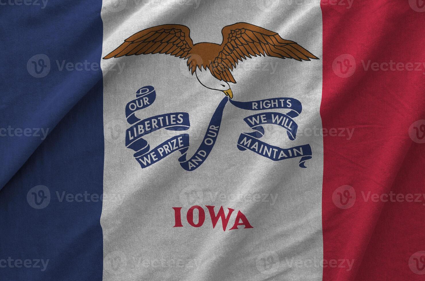 Iowa US state flag depicted on folded wavy fabric of old cloth photo