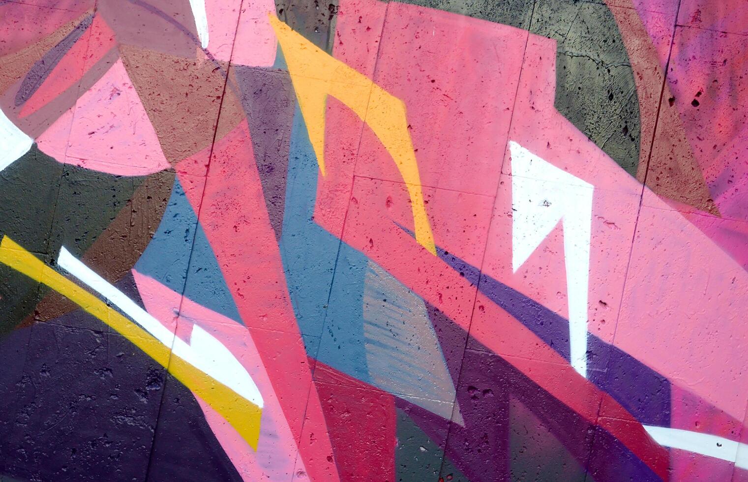 Colorful background of graffiti painting artwork with bright aerosol outlines on wall. Old school street art piece made with aerosol spray paint cans. Contemporary youth culture photo