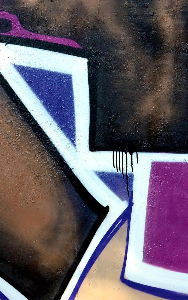Colorful background of graffiti painting artwork with bright aerosol outlines on wall. Old school street art piece made with aerosol spray paint cans. Contemporary youth culture photo