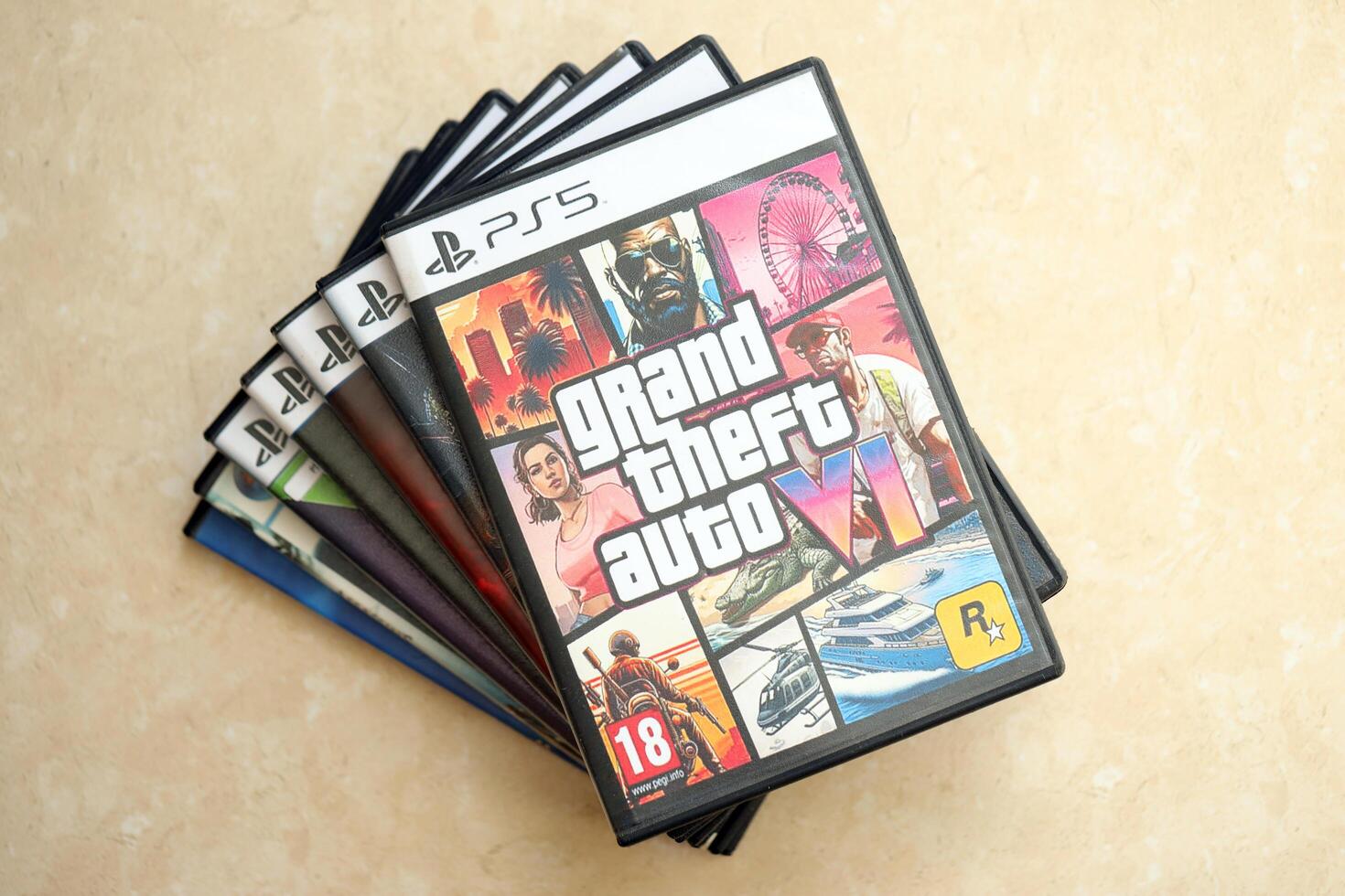 KYIV, UKRAINE - JUNE 26, 2024 Grand Theft Auto 6 PS5 game disc box for console gaming. Fictional fan-made game disc pack cover photo