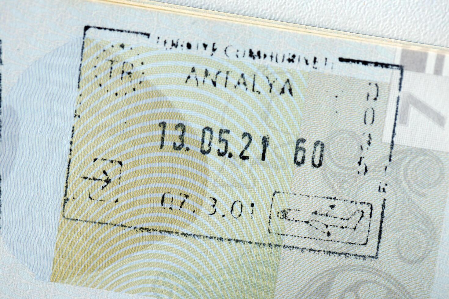 KYIV, UKRAINE - APRIL 20, 2024 Page of foreign passport with visas, Turkiye border stamps, permits to enter countries, concept of traveling around the world, travelers document photo