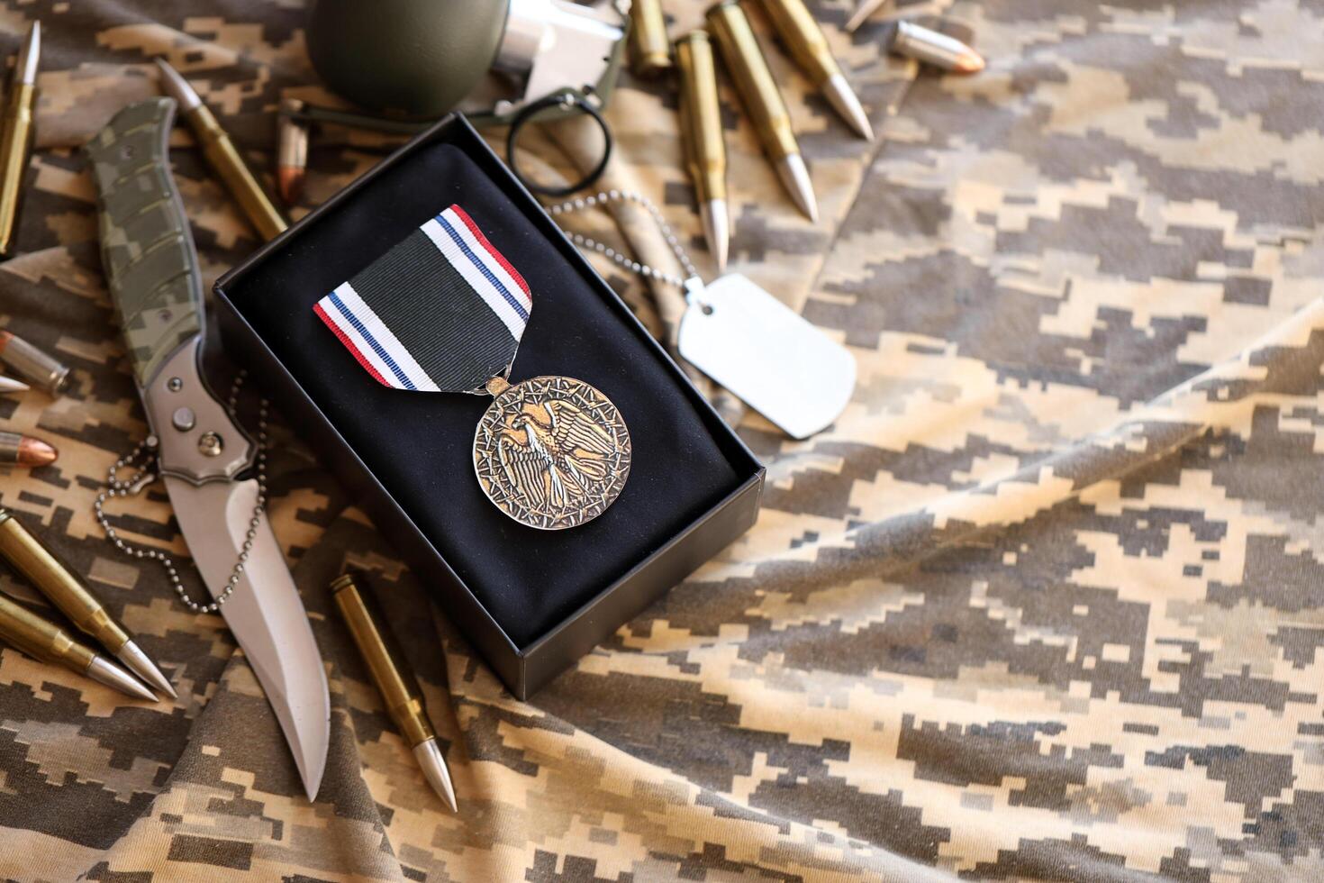 KYIV, UKRAINE - JULY 10, 2024 Prisoner Of War medal. United States military award medal with ribbon and pin. Handmade paper theater props photo