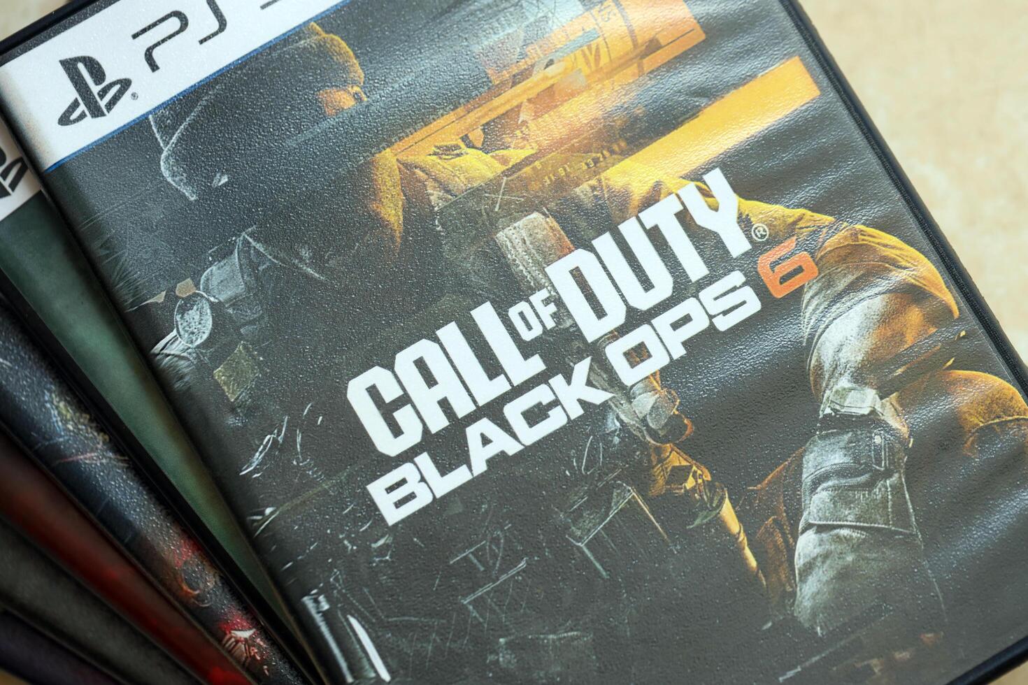 KYIV, UKRAINE - JUNE 26, 2024 Call of Duty Black Ops 6 PS5 game disc box for console gaming. Popular game disc photo