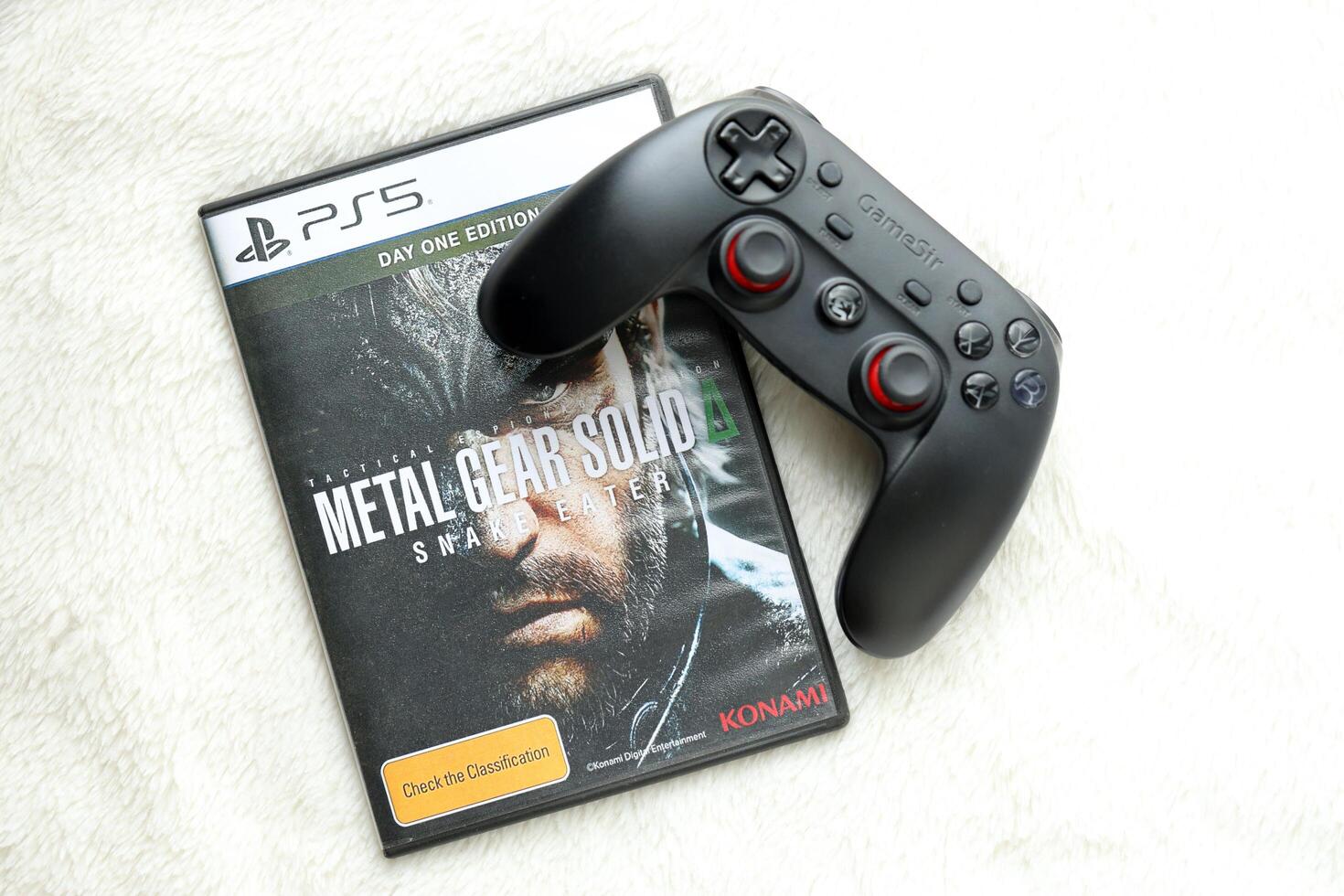 KYIV, UKRAINE - JUNE 26, 2024 Metal Gear Solid Delta Snake Eater PS5 game disc box for console gaming. Popular game disc photo