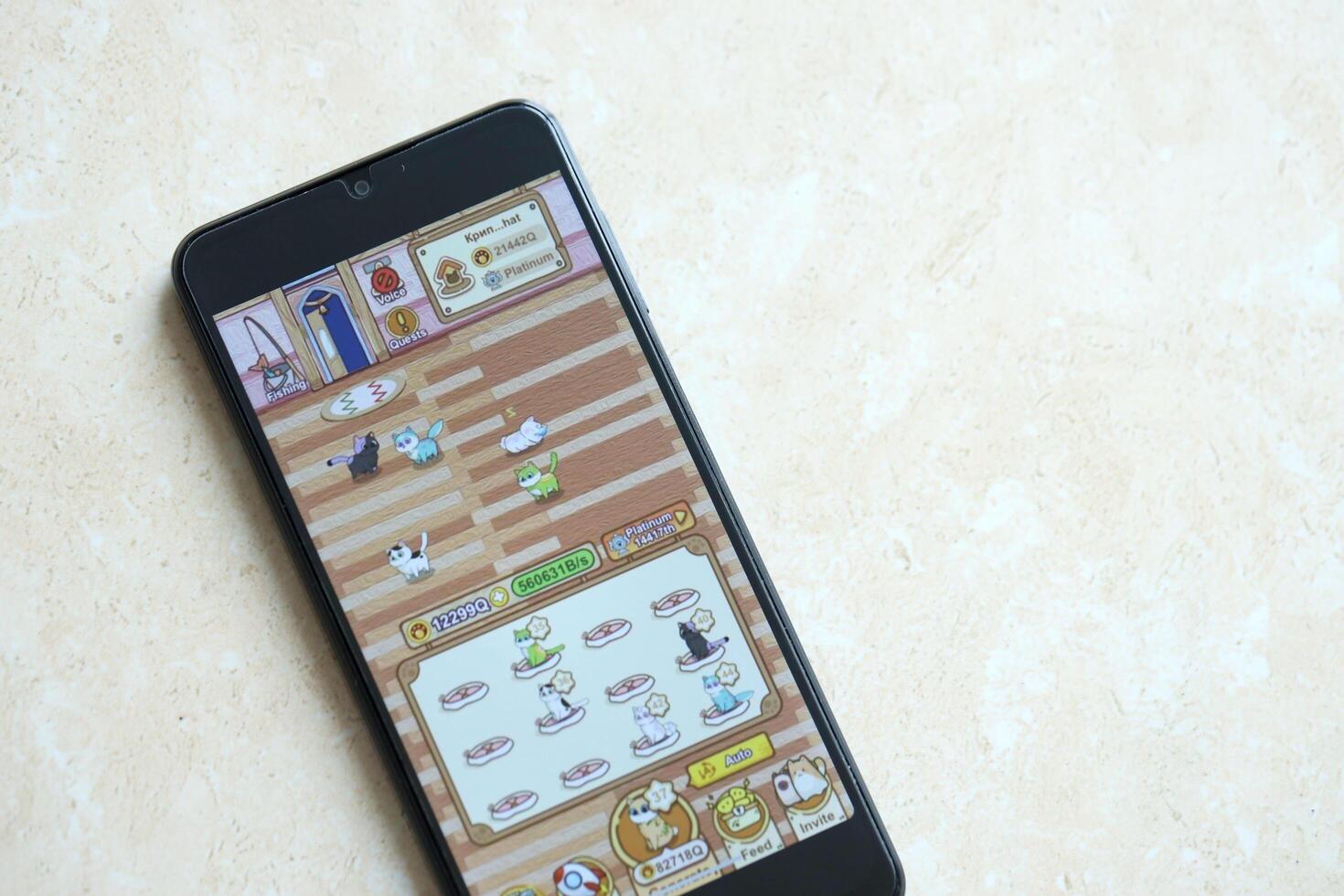 KYIV, UKRAINE - APRIL 20, 2024 Catizen telegram bot on smartphone screen. Catizen is a viral Telegram based crypto game for earn tokens by managing virtual crypto exchange photo