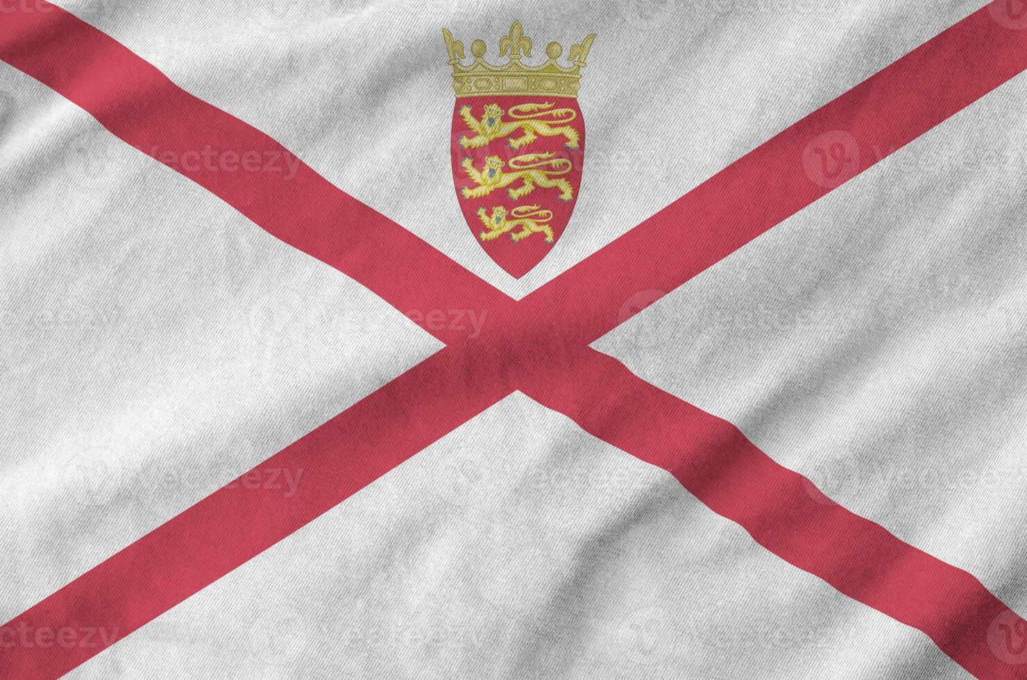 Jersey flag depicted on folded wavy fabric of old cloth photo