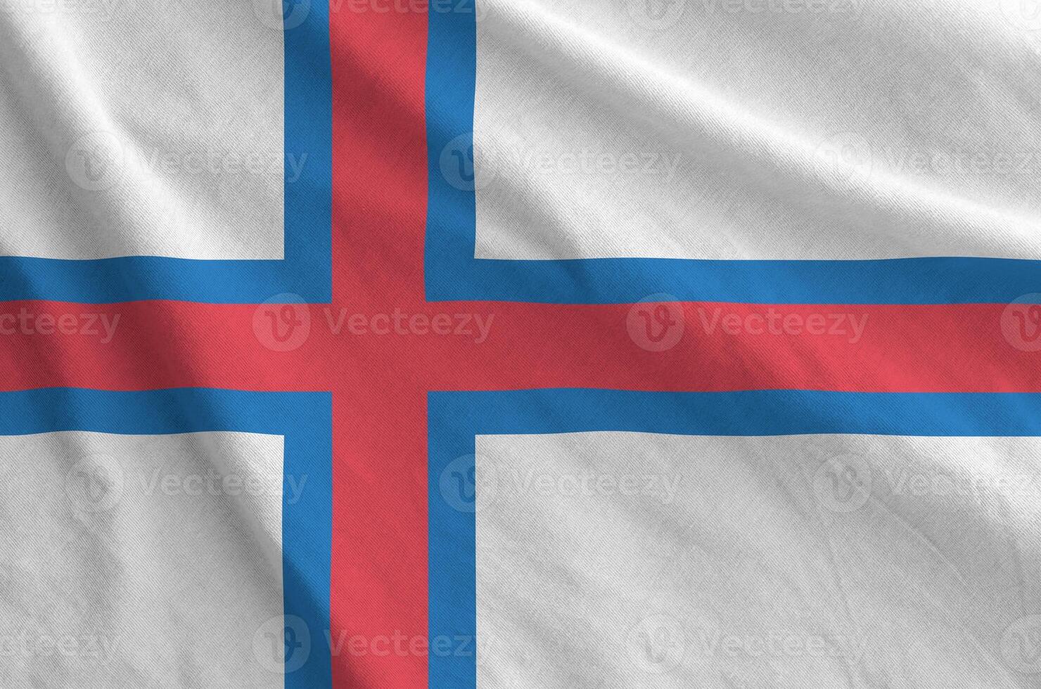 Faroe islands flag depicted on folded wavy fabric of old cloth photo